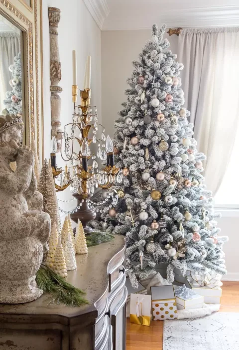 Beneath the tree I set an array of gold rimmed gift boxes, and instead of a traditional skirt I used a faux fur throw in a snowy winter white