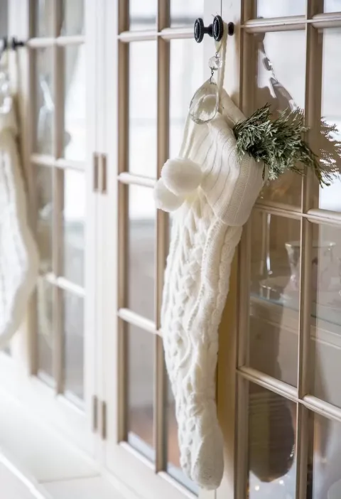 I hung fisherman knit and draped large crystal drops from the knobs on the hutch